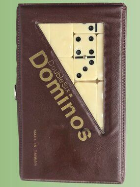 Double-Six Dominoes Set in a brown leatherette travel case metal spinners